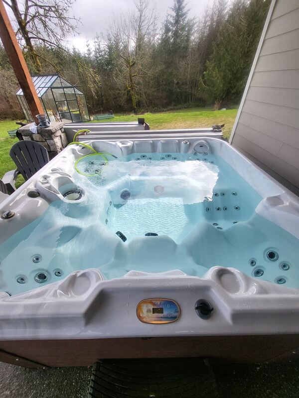 Same hot tub refilled with crystal-blue water after service