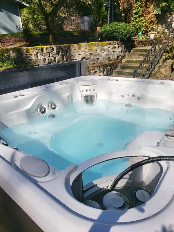 Sparkling hot tub in a stone-step garden