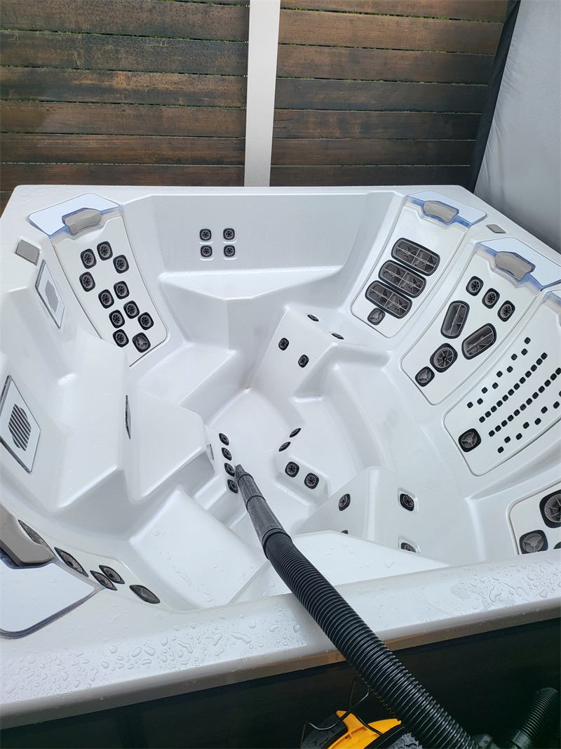 Freshly scrubbed empty hot tub shell after a deep cleaning
