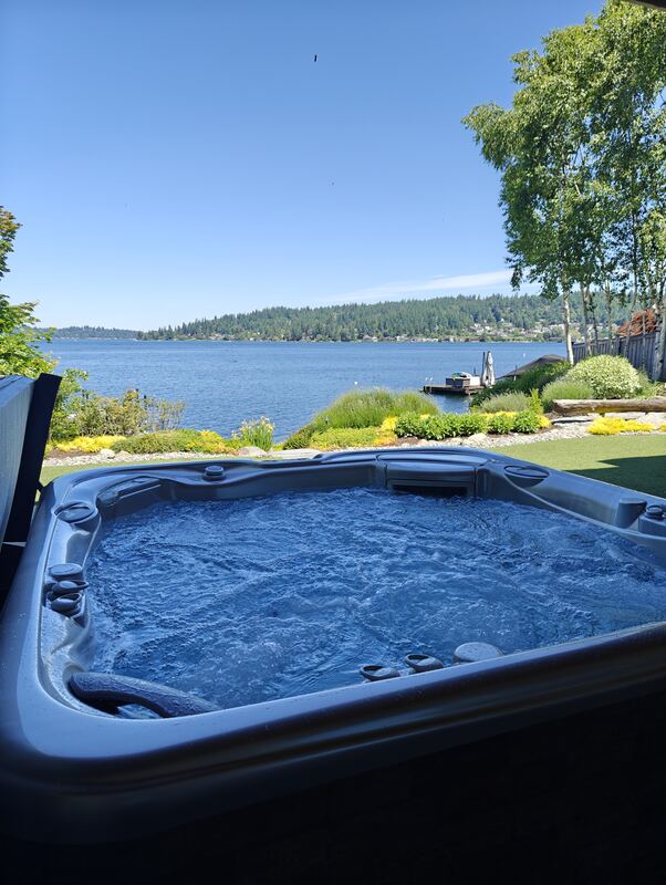 Deep-blue churning water on a lakefront lawn after service