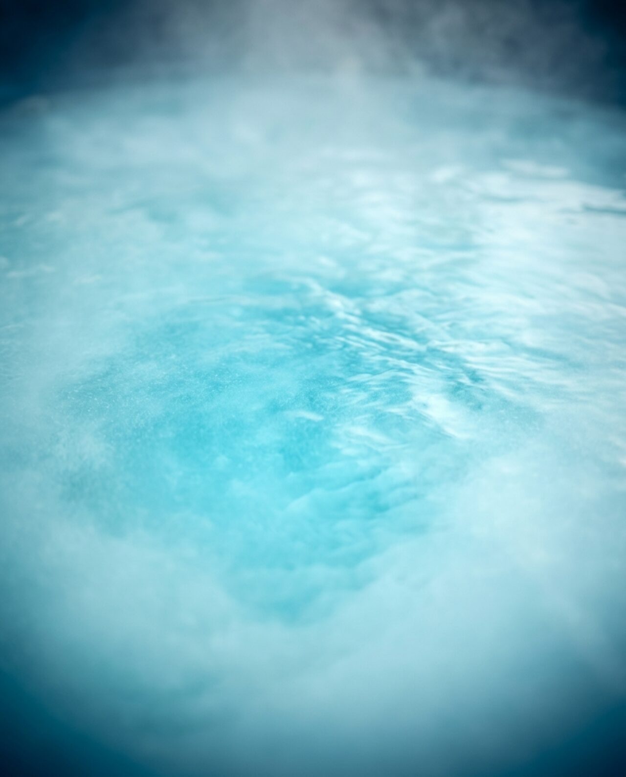 Stylized close-up illustration of cloudy, hazy hot tub water