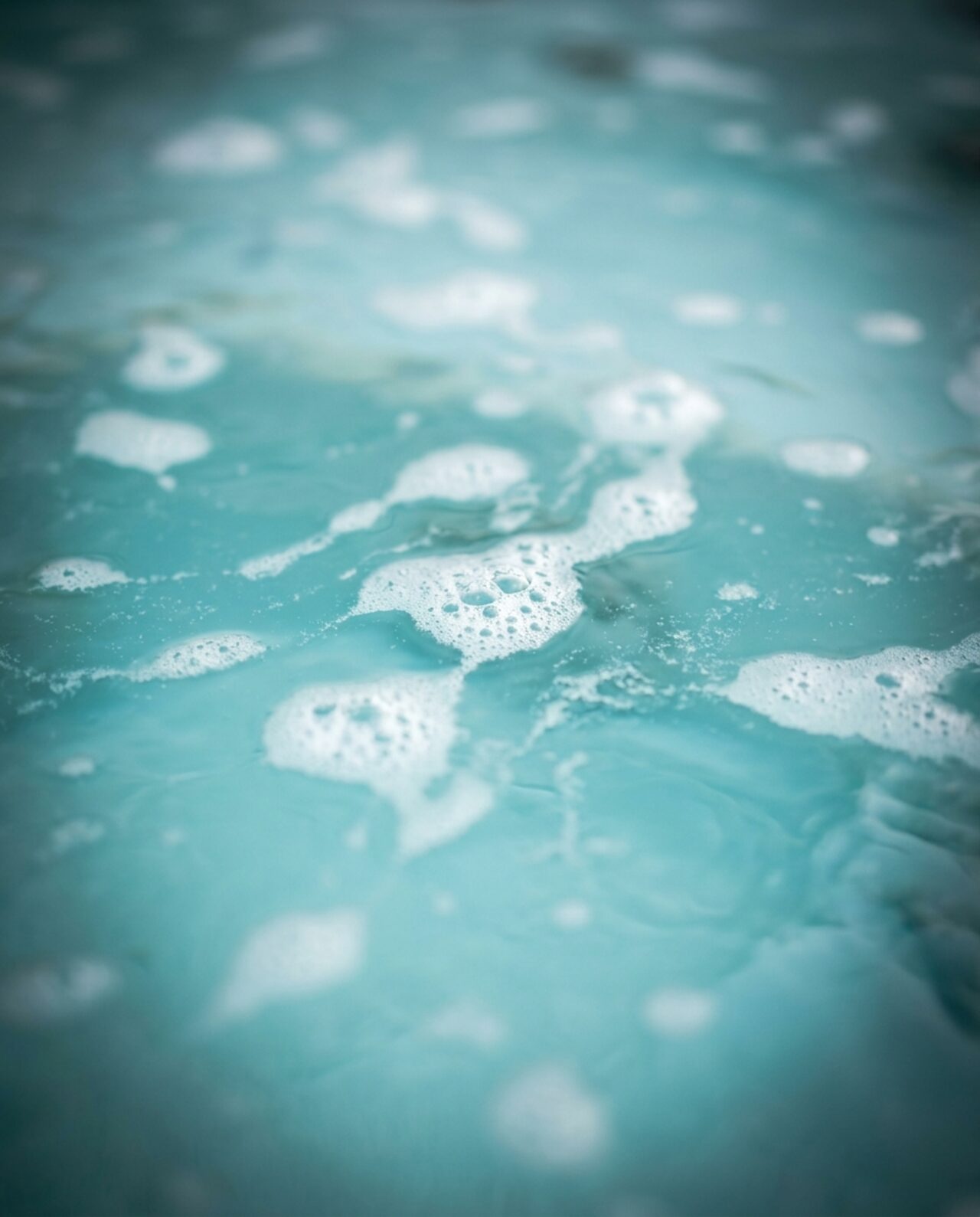 Stylized close-up illustration of foamy hot tub water